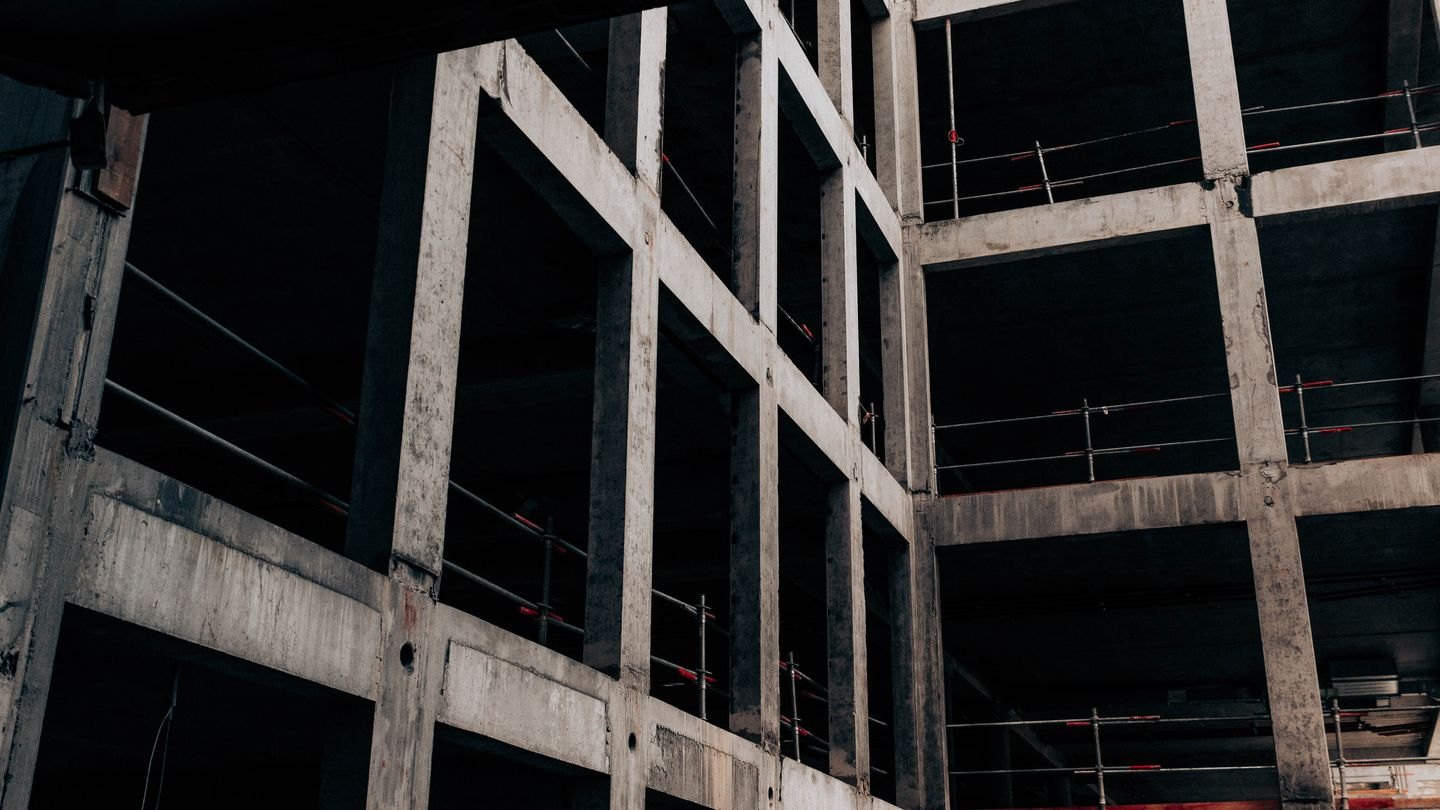 Structural concrete framework of a multistory building under construction.